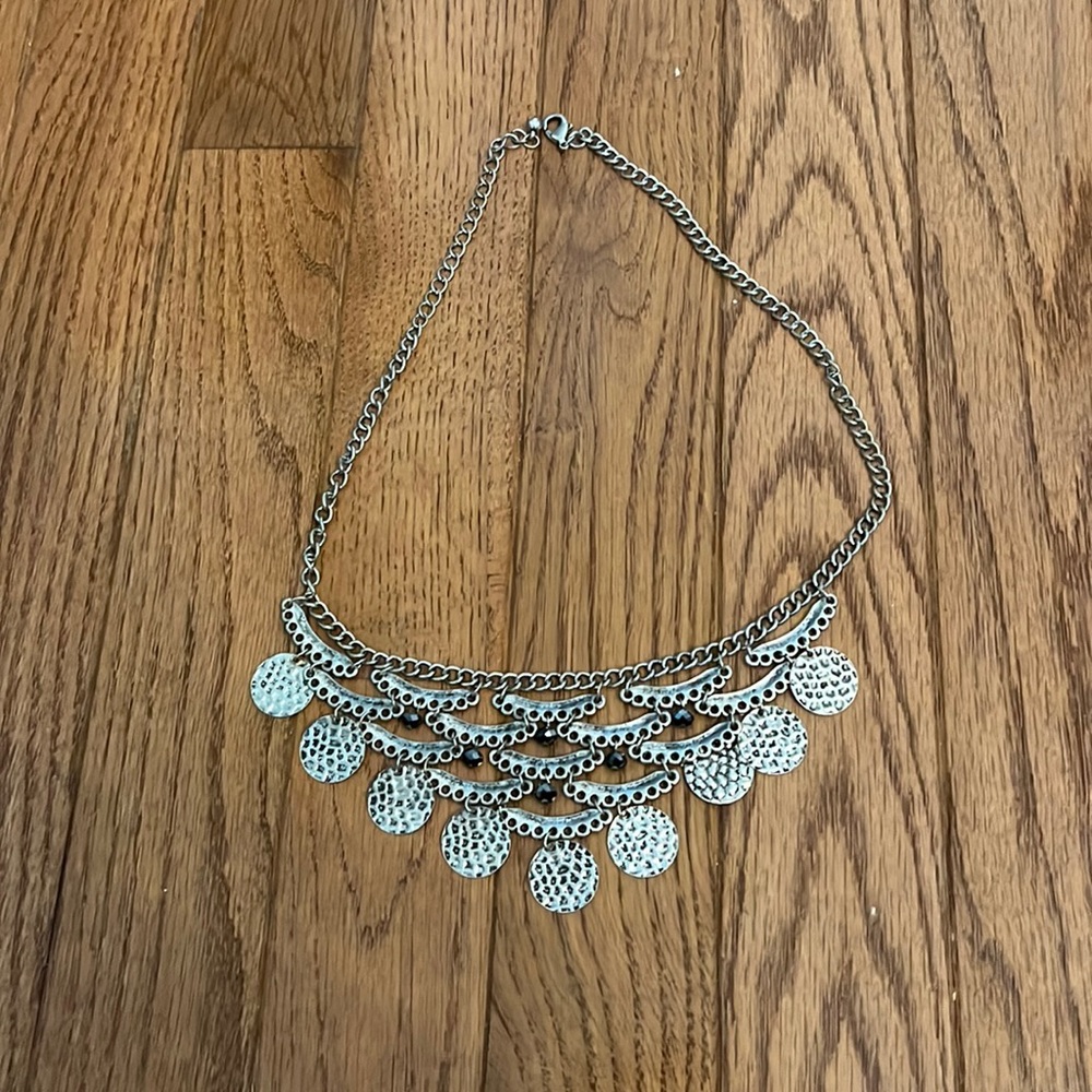 silver necklace with a thicker chain